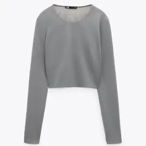 Grå tröja med öppen rygg från Zara i storlek XXL. Aldrig använd, prislapp kvar.