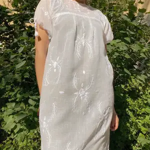 Vintage Dreamy Embroidered House Dress.  Romantic Cottage Core Style  Handcrafted with Tie Sleeves & Floral Embroidery. One tassel missing, not noticeable when worn  Model is 160cm (5”3) and generally fits XS/S. Very Good Condition.  100% Cotton
