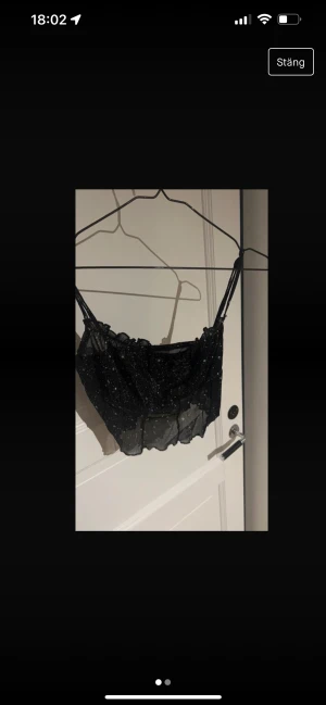 Topp - Glittrig i mech