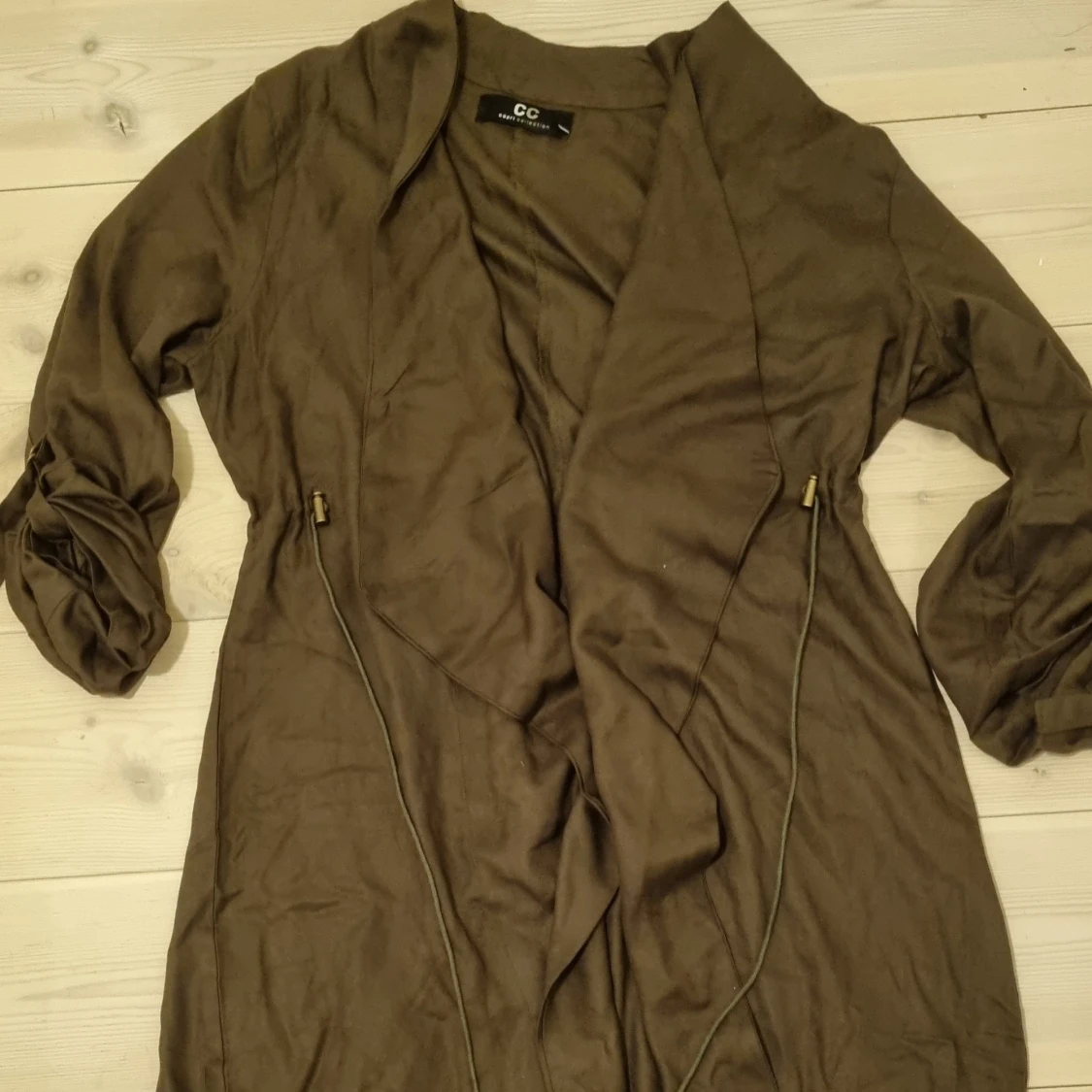 Oanvänd längre kofta