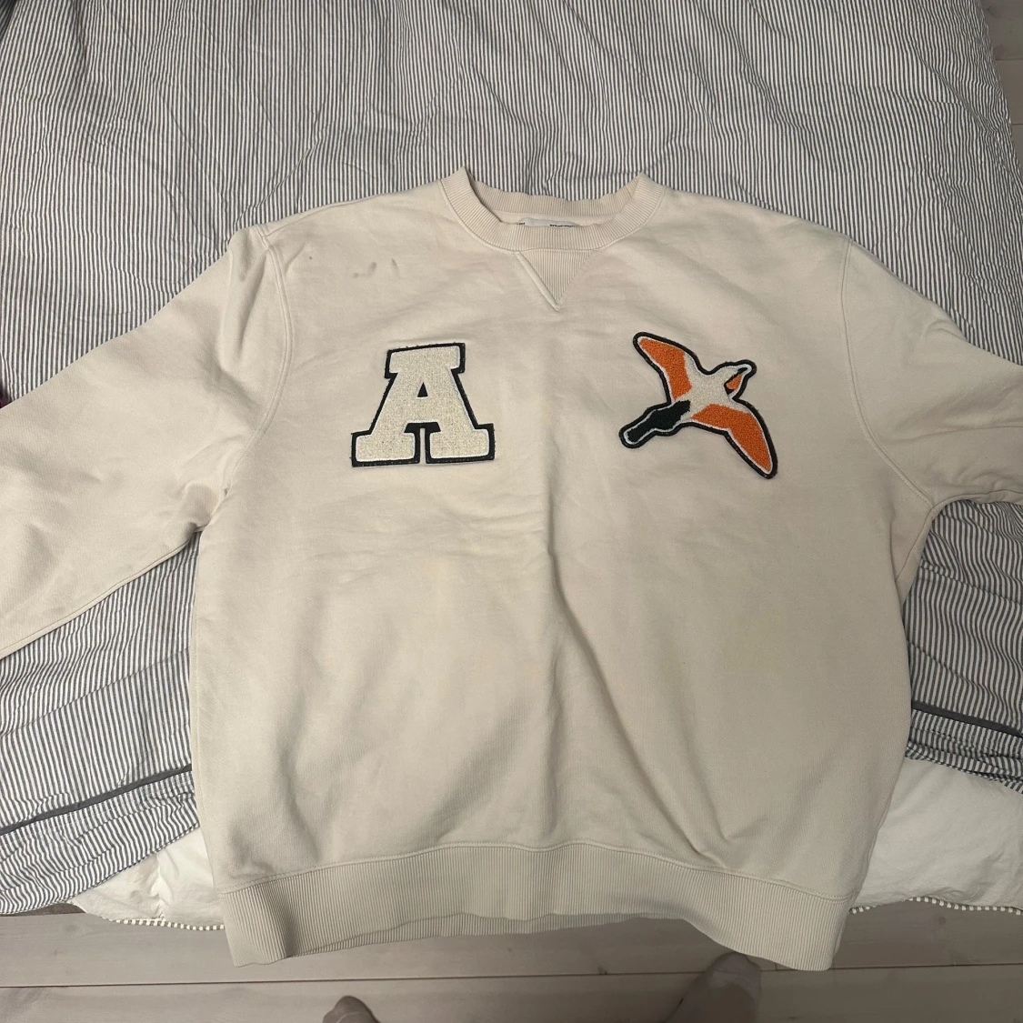 Vit sweatshirt från Axel Arigato Varsity Bird