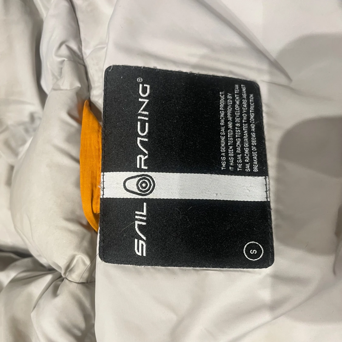 Orange dunjacka från Sail Racing - 2