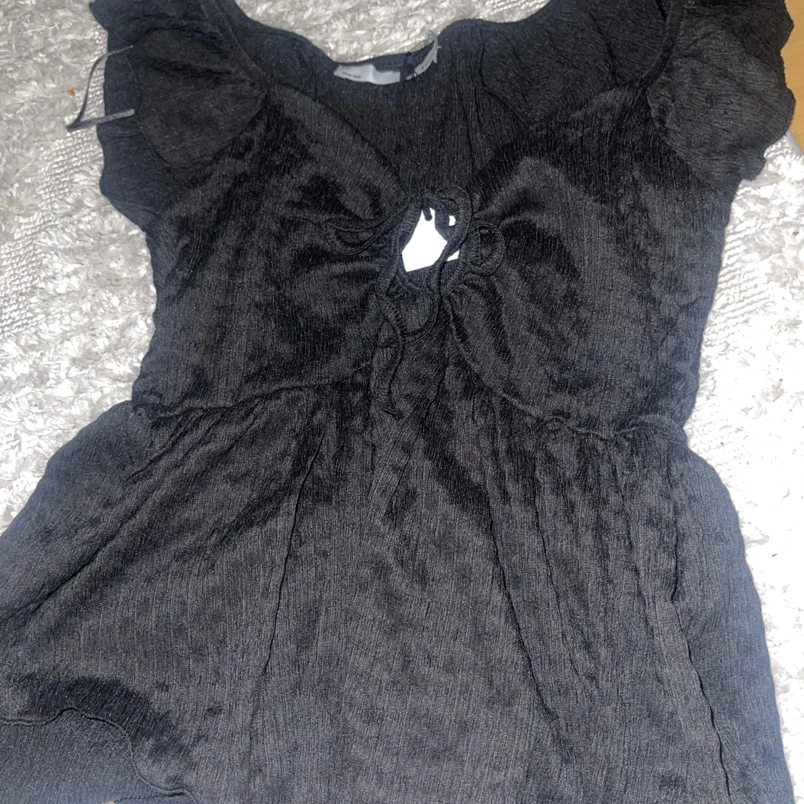 Svart topp med knytning - 90