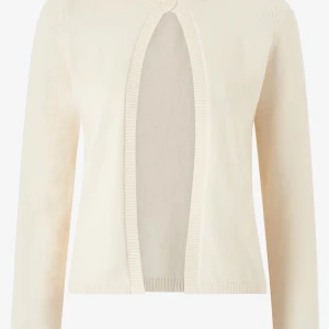 Beige kofta med öppen design - Snygg creamvit kofta med en unik öppen design framtill. Perfekt för lager-på-lager och ger en stilren look. Långärmad med ribbade kanter för extra komfort. Storlek xs och säljes för 180 köpt för 350.