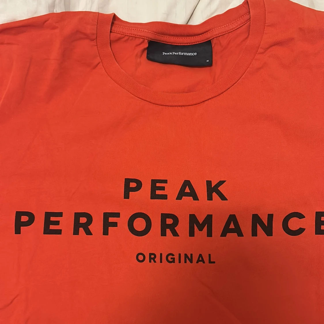 Orange t-shirt från Peak Performance - 90