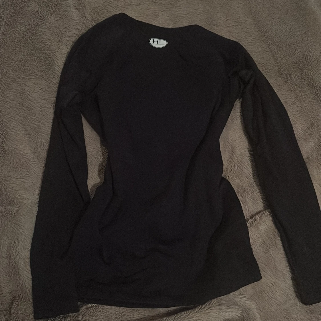 Svart långärmad tröja från Under Armour - 90