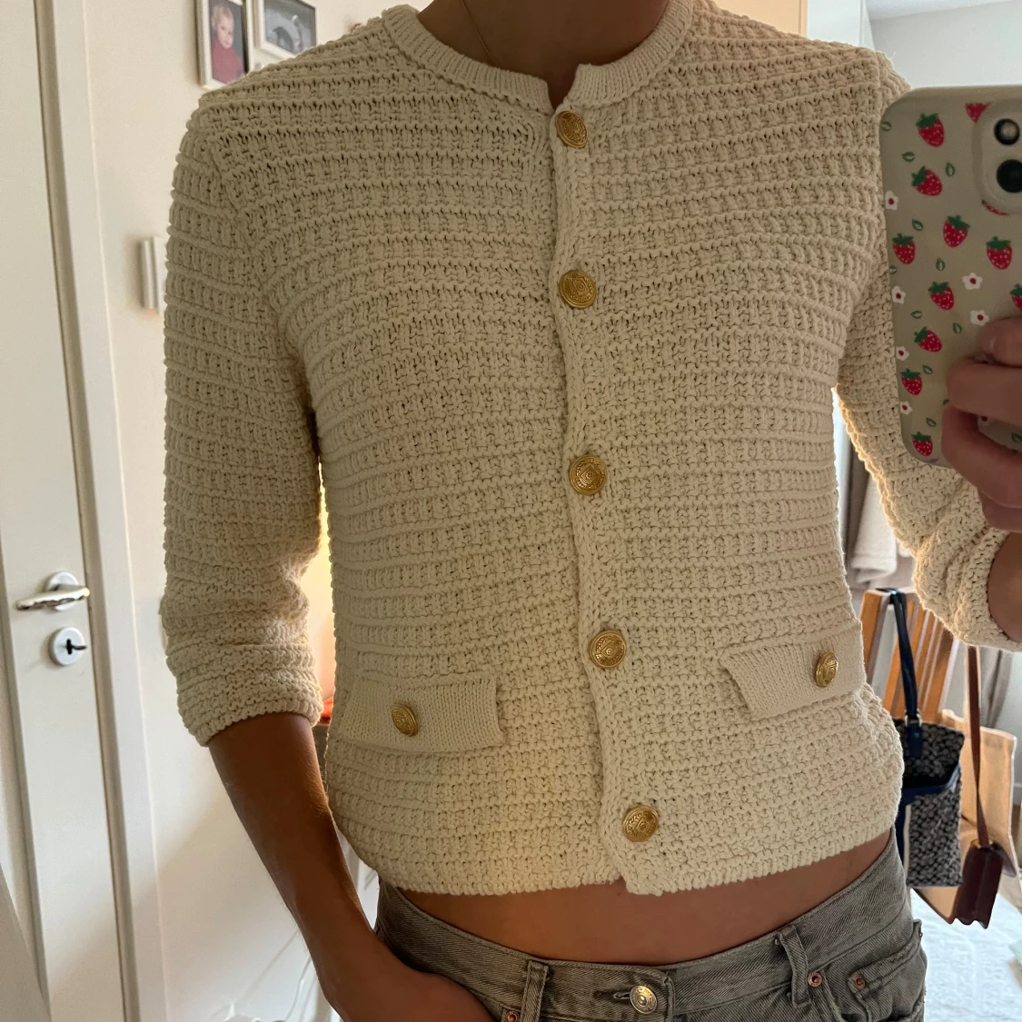 Kofta med guldknappar 