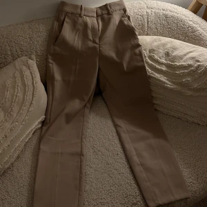Beige kostymbyxor  - Xs