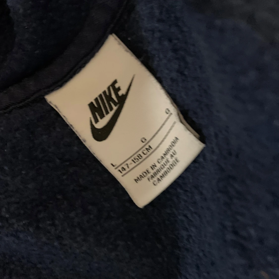 Mörkblå hoodie från Nike - 1