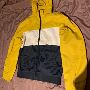 Blue, White, Yellow H&M Jacket - In good condition, no visible marks.