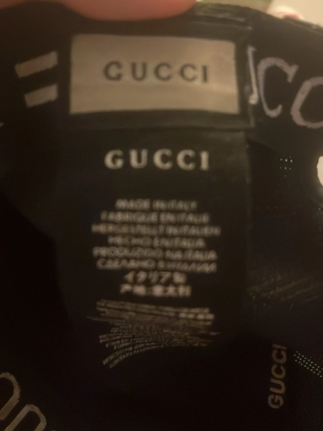 Svart keps från Gucci med meshdetaljer