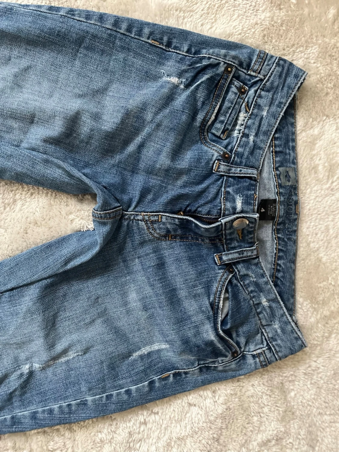 Lågmidjadf bootcut jeans med hål