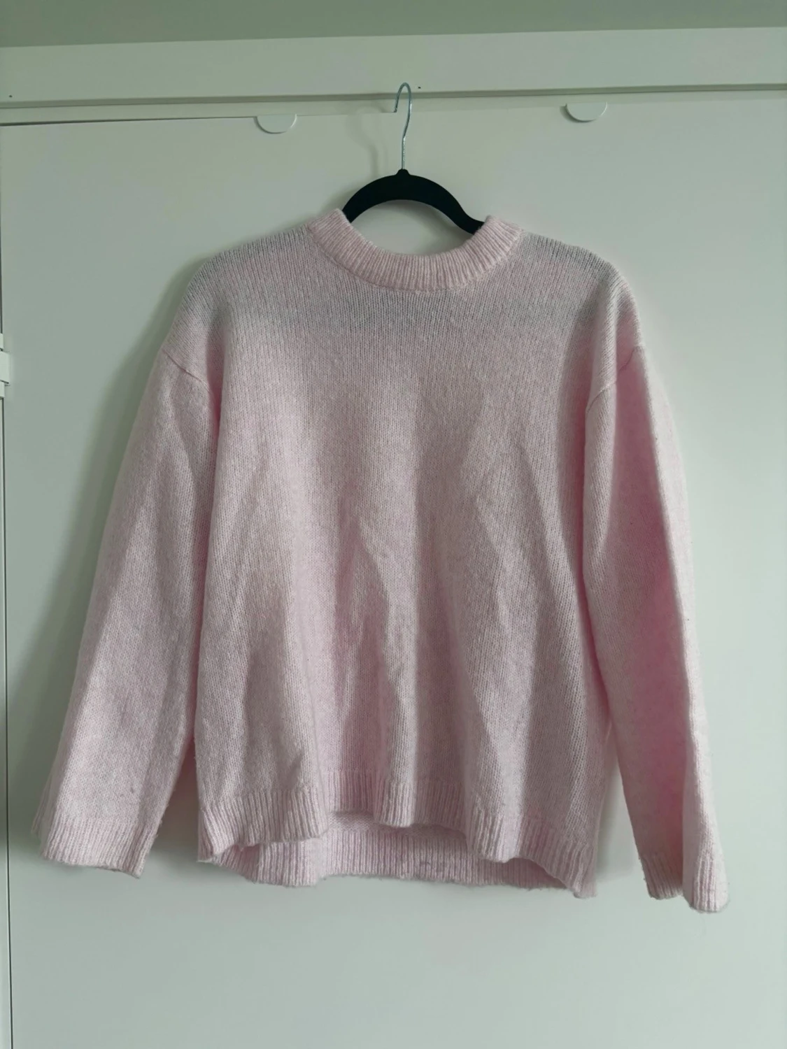Ljusrosa stickad tröja