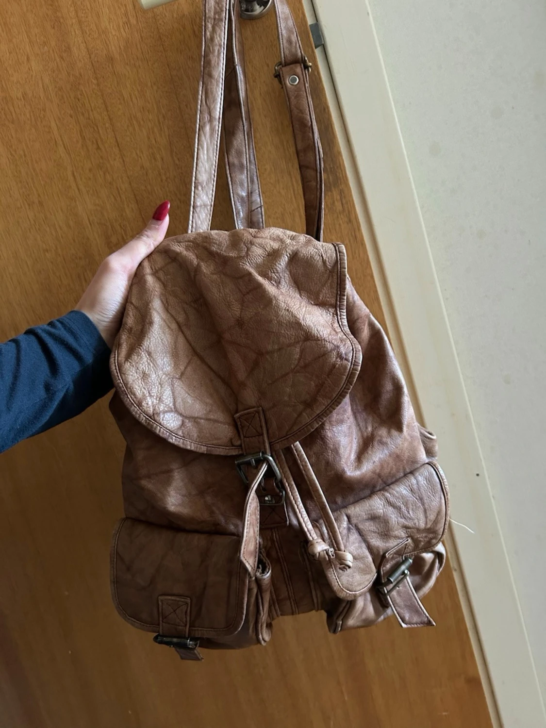 Brun ryggsäck i läder. Vintage stil