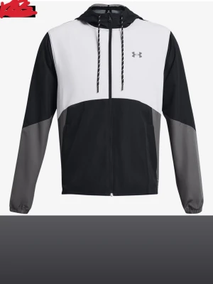 Under Armour svartvit vindjacka - Snygg vindjacka från Under Armour i svart, vitt och grått. Jackan har huva med dragsko, hel dragkedja och elastiska muddar. Perfekt för blåsiga dagar och sportiga outfits. Liten logga på bröstet och cool färgblock-design.