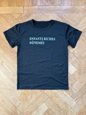T-shirt Enfants Riches - Size M Polyester (t-shirt is shiny)  Letters are printed  Never worn 