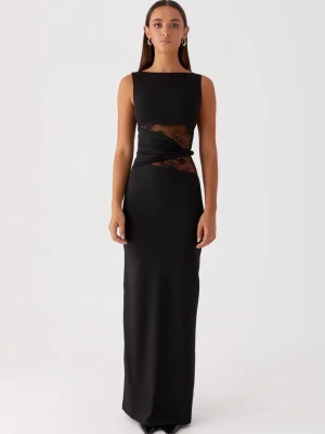 Svart långklänning med spetsdetalj - Supersnygg svart långklänning med ärmlös design och transparent spetsdetalj runt midjan. Klänningen har en tight passform och rund halsringning. Materialet ser ut att vara polyester eller liknande, vilket ger en slät och elegant look. Perfekt för nyår eller finmiddag✨