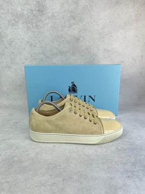Lanvin DBB1 cap toe sneaker - – Condition: 9/10 - pristine  - Size: 40/UK6  – What is included: Box & dustbag   – Retail price: 5000 + SEK  Please note that Lanvins fit big and our recommendation is to go one size down
