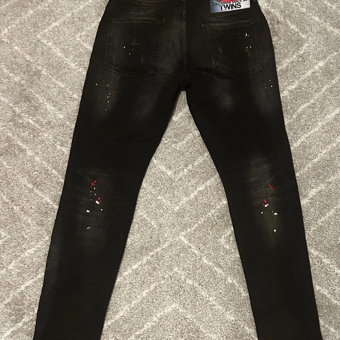 Svarta Dsquared2 jeans med färgstänk - 1