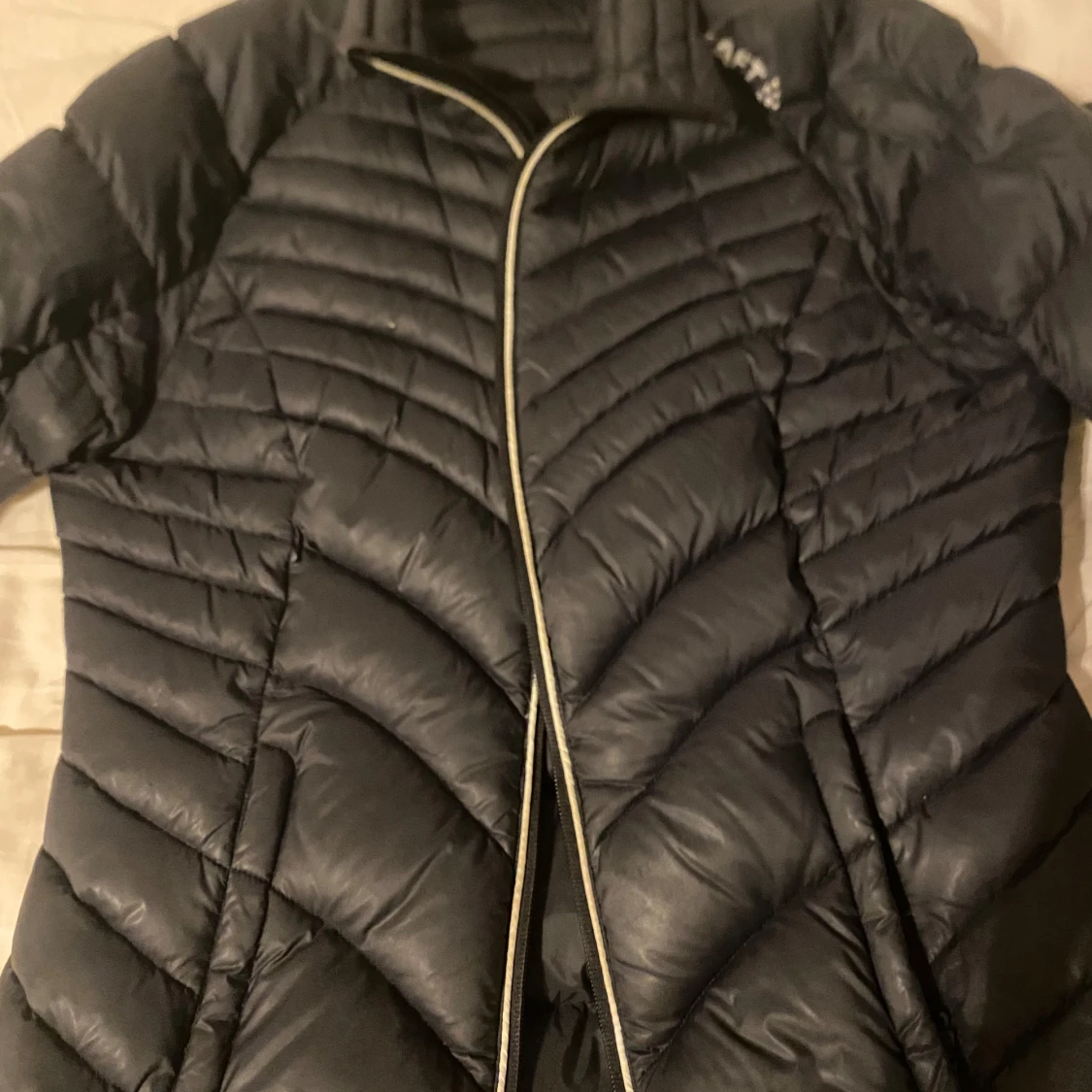 Svart dunjacka från Craft, M