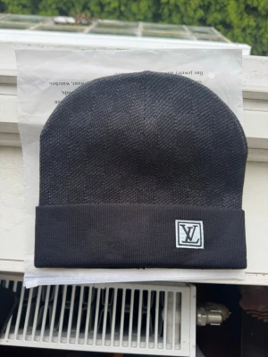 Svart rutig mössa - Oanvänd