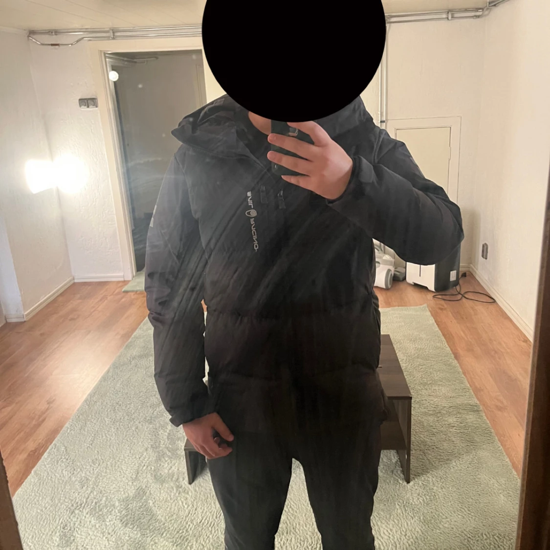 Svart dunjacka från Sail Racing