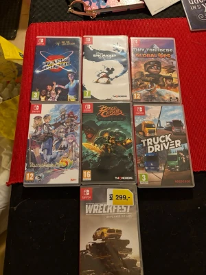 Nintendo Switch spelpaket (7 titlar) - Paket med 7 Nintendo Switch-spel: Are You Smarter Than a 5th Grader?, Disney Epic Mickey Rebrushed, Tiny Troopers Global Ops, Rune Factory 5, Battle Chasers Nightwar, Truck Driver och Wreckfest. Alla fodral i gott skick, perfekt för spelentusiasten! Ett spel är ännu inplastat 