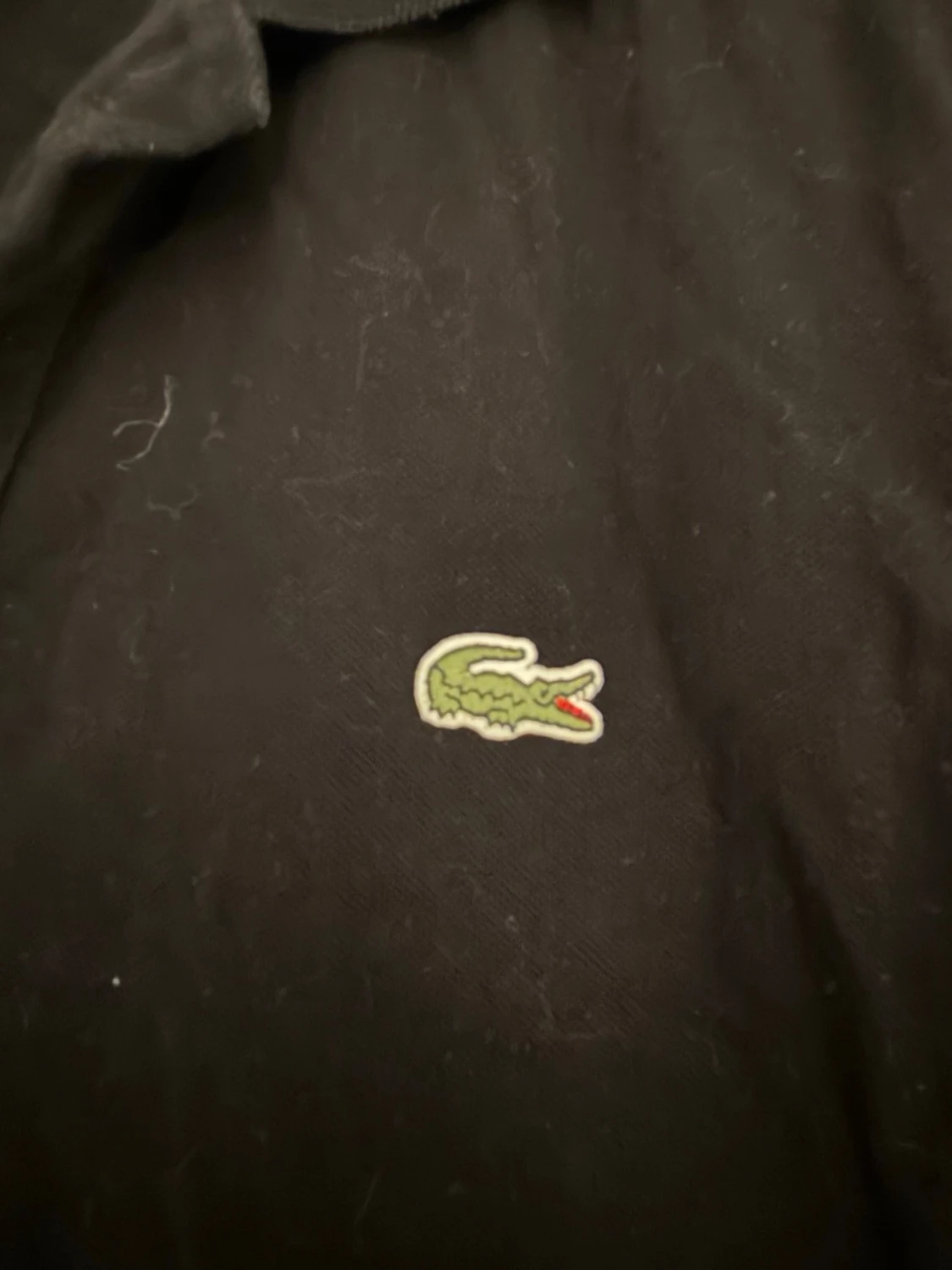 Svart pikétröja från Lacoste - 1