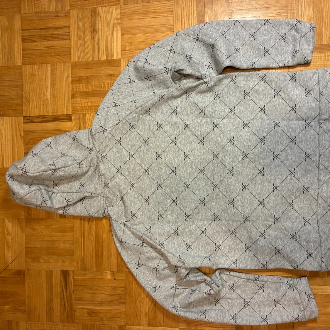 Grå hoodie från Bauer med hockeymönster - 1