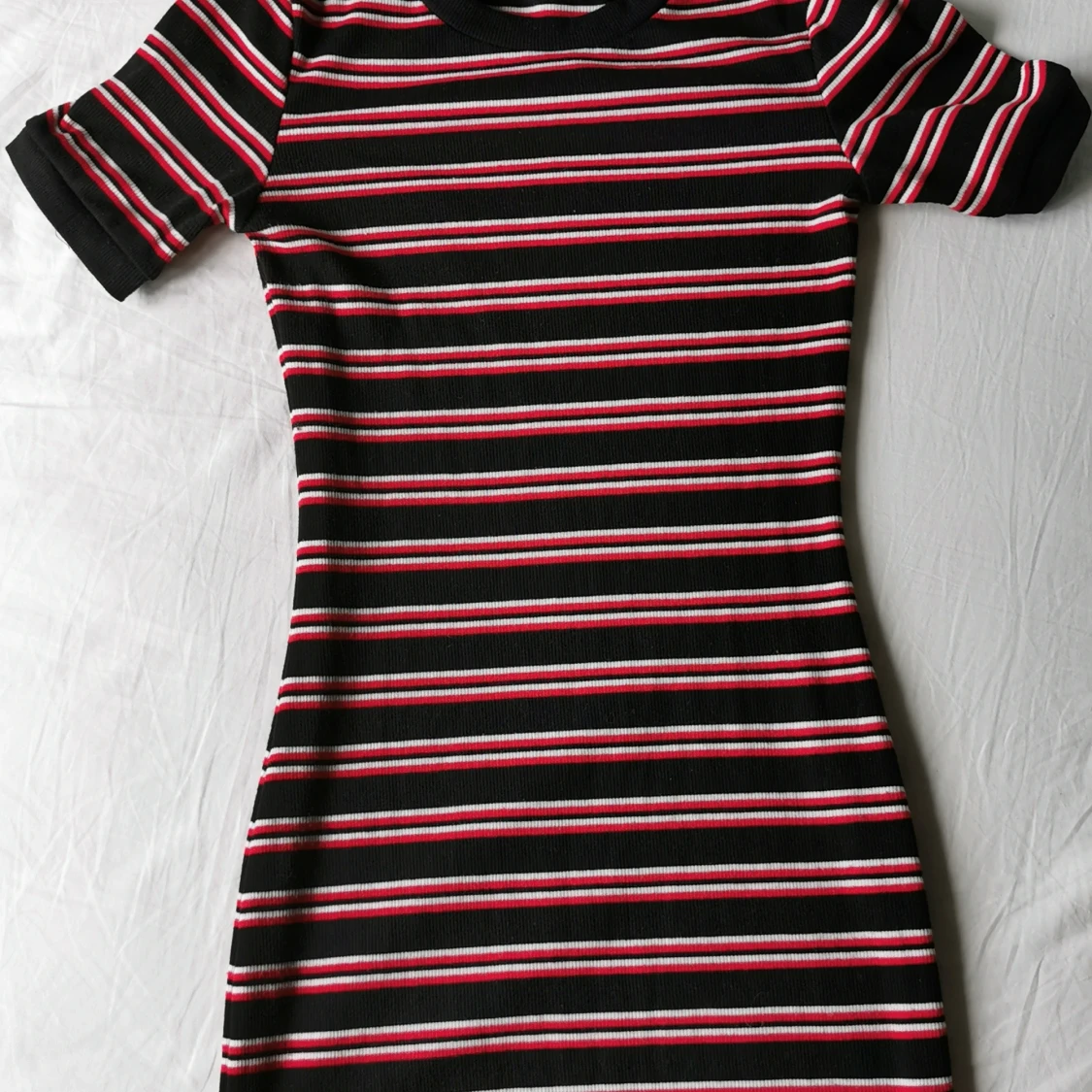 Tajt figursydd klänning