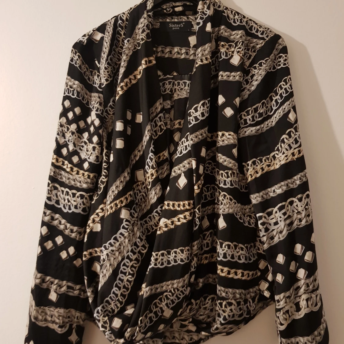 Kedjemönstrad omlottopp stl L