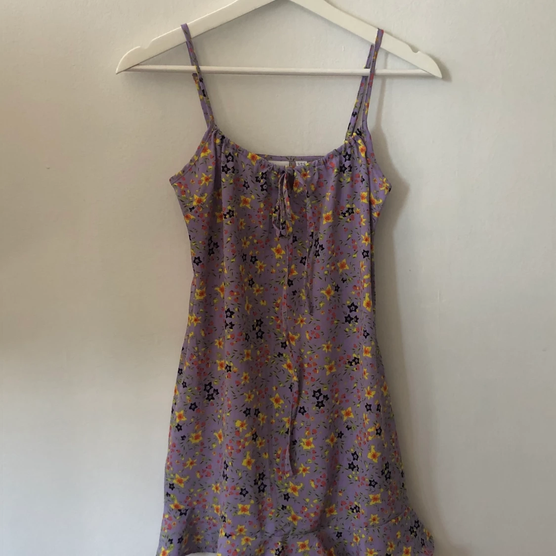 Blommig klänning från collusion strl 34