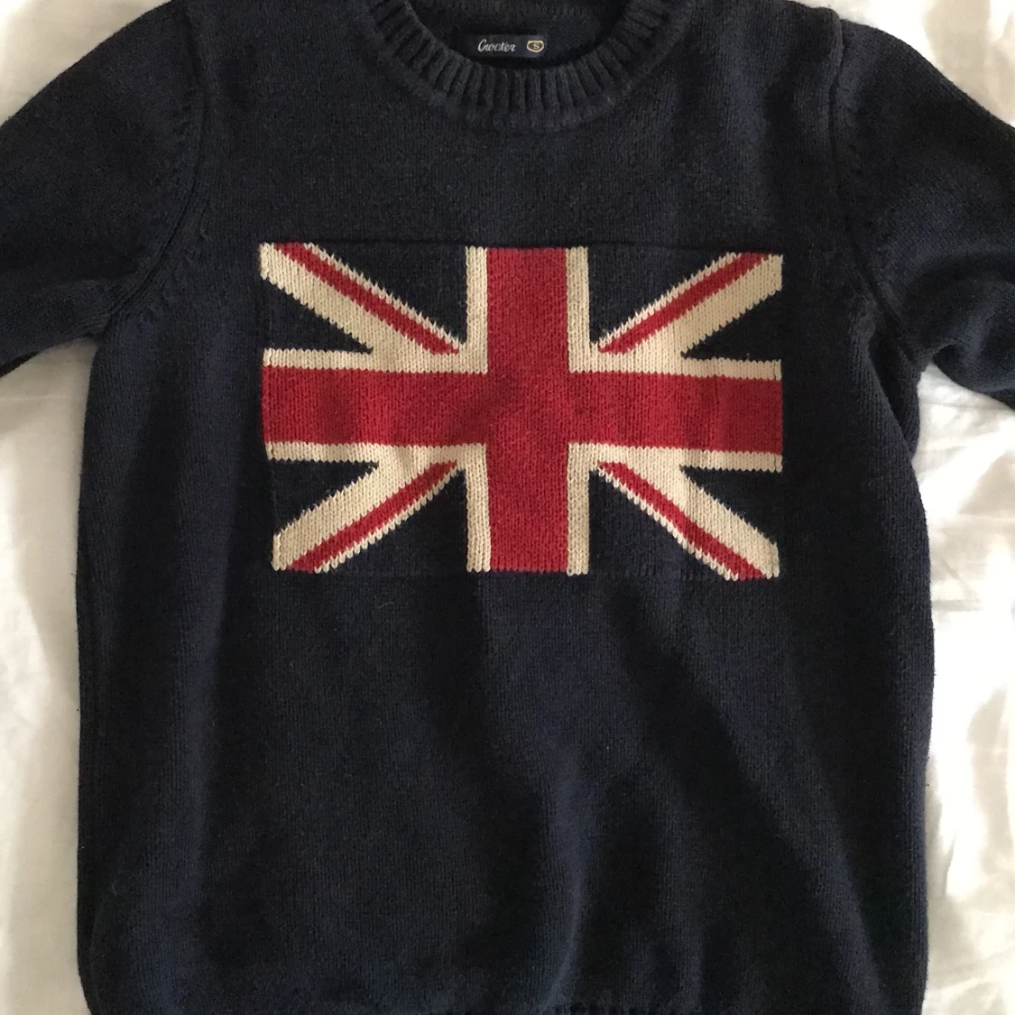 Stickad mjukiströja