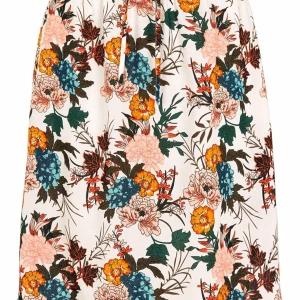 Lina Beach Skirt White / Floral - Superfin, mönstrad strandkjol från HAPPY HOLLY. Kjolen har en rak passform med resår och dragsko i midjan och är rundad i nederkanten. - Passform: Normal, Utsälld - Vävd, stum kvalité. - Resår i midjan. - Dragsko med knytband i midjan (avtagbart).