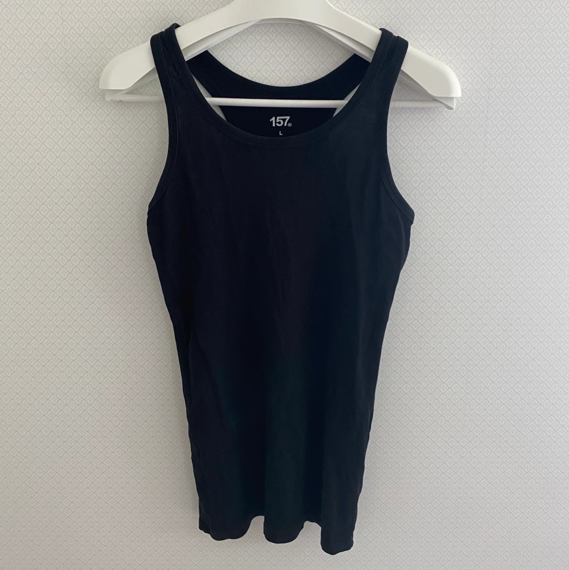 Svart långt brottarlinne