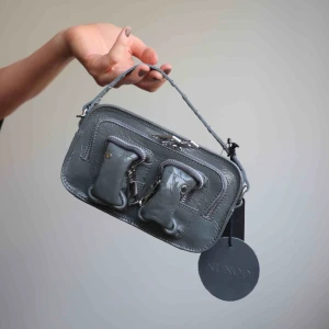  - Oanvänd nunoo väska med prislapp. Frakt på 63kr tillkommer 