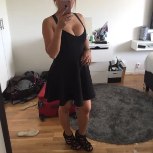  - Cross back design black cleavage dress size S