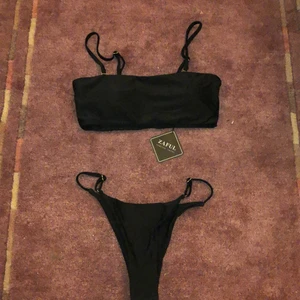 Black bikini size S (never worn!!) - Black bikini, size small (would also fit someone medium), bandeau (with including straps), from ZAFUL, comes in a packet! Has never been worn. 