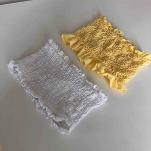  - Två söta tubtoppar(vit och gul) i stretch, xsmall. Köparen står för frakt ev. Möts upp i Stockholm.